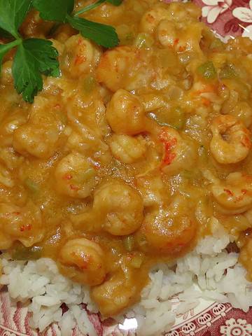 A serving of Crawfish Étouffée on white rice.