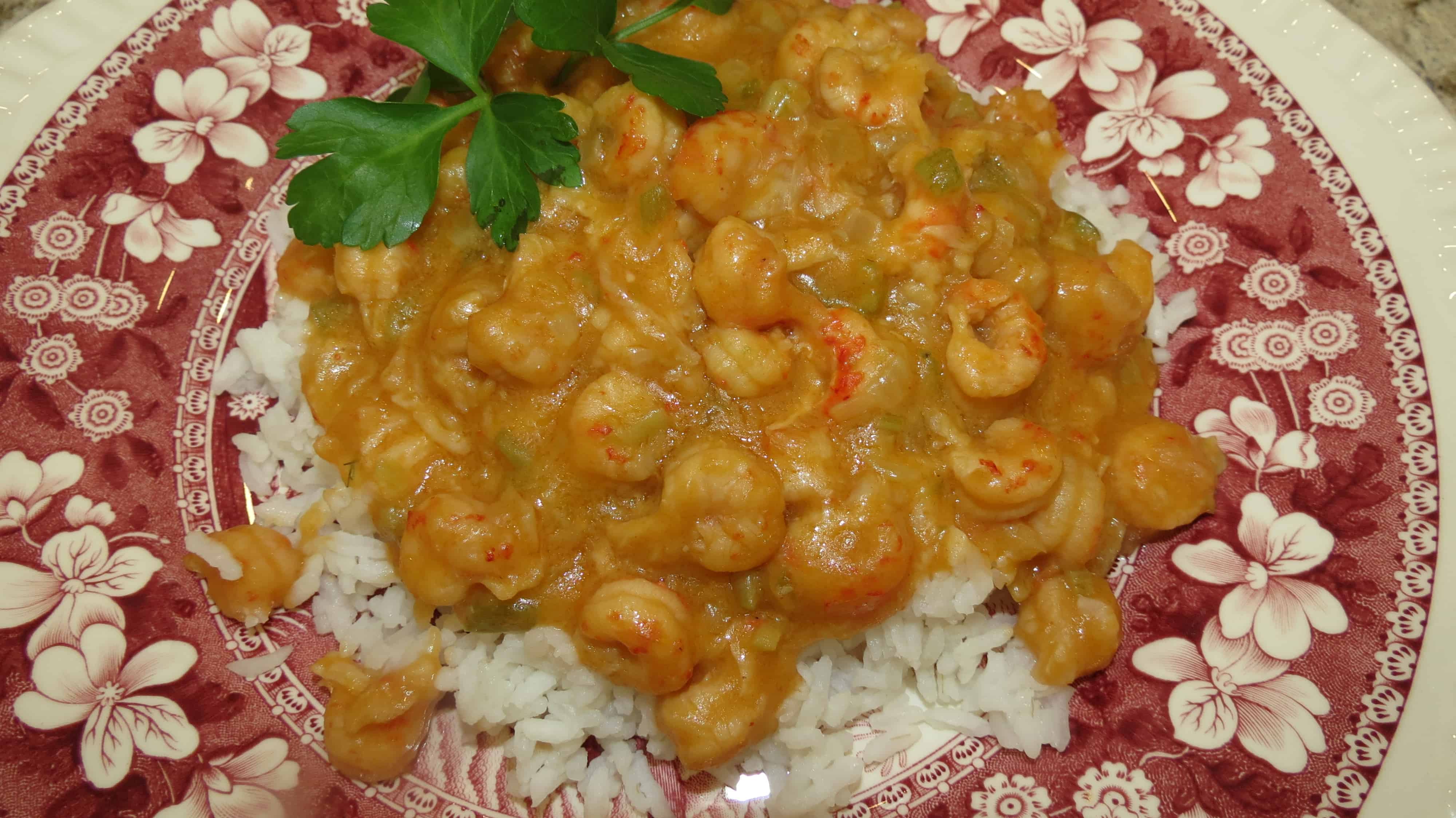 A serving of Crawfish Étouffée on white rice.