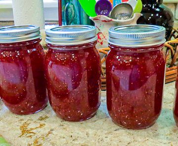 A line of 5 jars of Strawberry Fig Jam.
