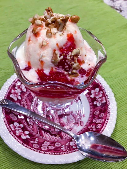 A bowl of ice cream topped with Strawberry Fig Jam.