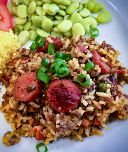 A plate of jambalaya and butter beans.