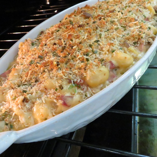 A casserole dish of Tasso Macaroni and Cheese in the oven.