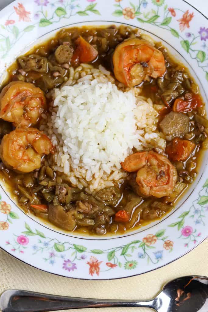 A bowl of Shrimp Okra Gumbo with rice for Mardi Gras Food Recipes.