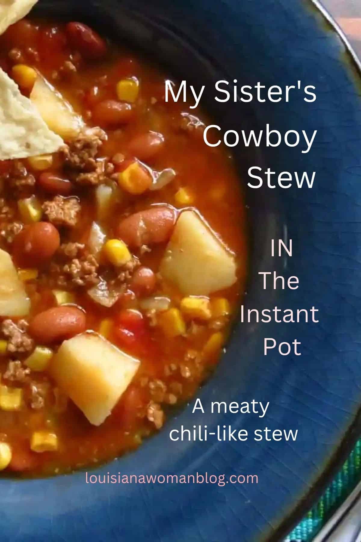 Cowboy stew of potatoes, beans, corn in a beefy tomato chili-like stew in a blue bowl.