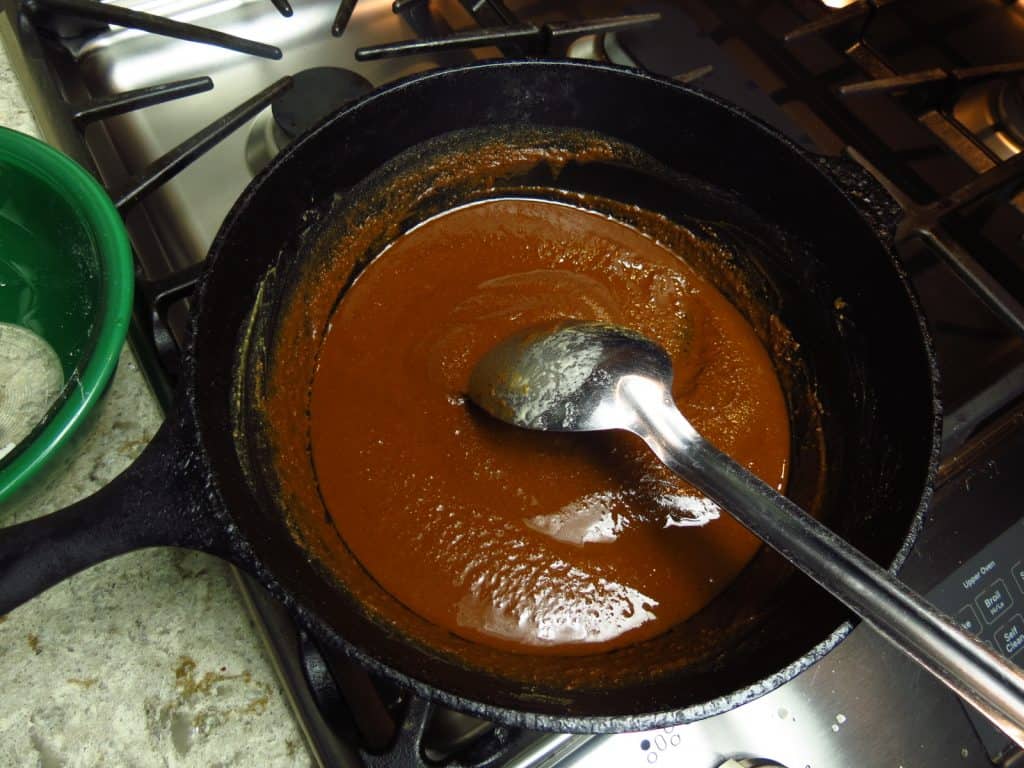 Black pot of dark roux.