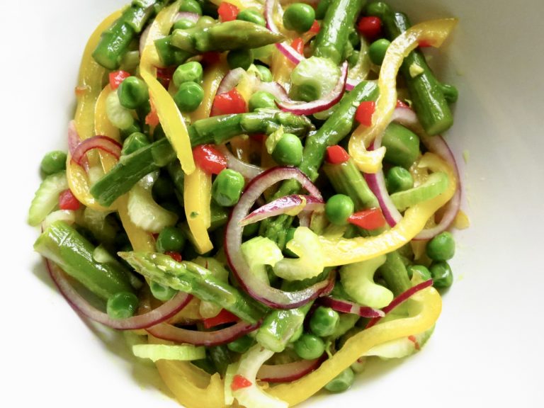 My Mardi Gras Salad is a tossed salad of peas, asparagus, onions, and peppers.