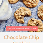 A glass fo milk with Chocolate Chip Cookies on a blue and white place mat.