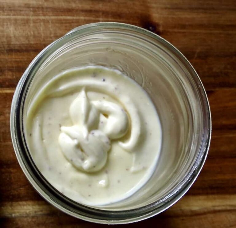 Overlooking Homemade Mayonnaise With A Creole Kick in a glass mason jar.
