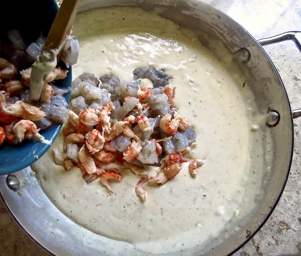 shrimp and crawfish added to cream sauce for Shrimp and Crawfish Pasta