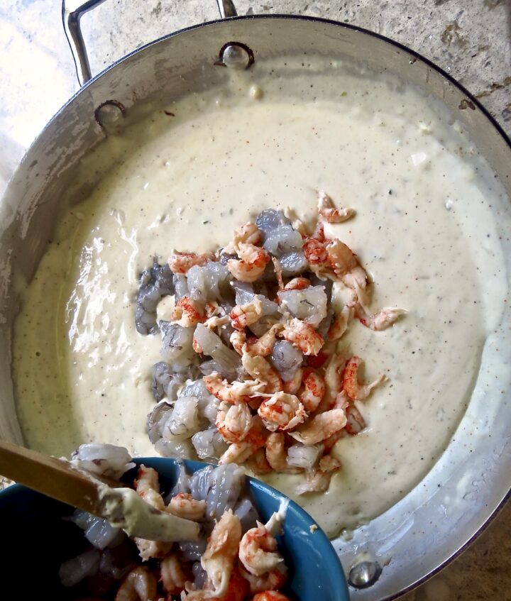 shrimp and crawfish added to cream sauce for Shrimp and Crawfish Pasta