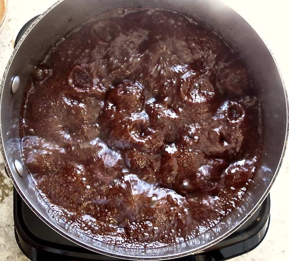 Chocolate boiling in a pot.
