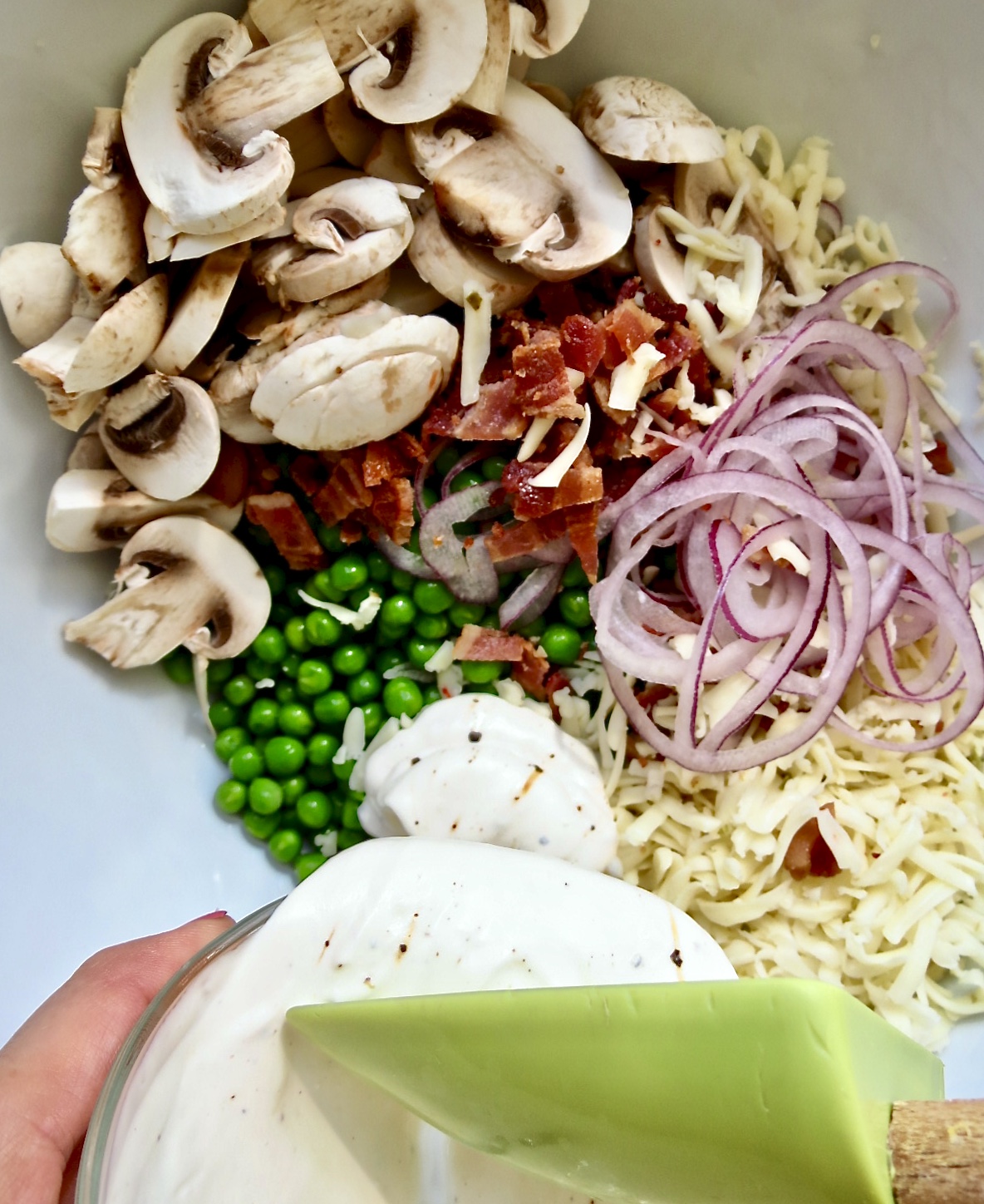 Ingredients in a white bowl to the Pea Salad, The Forgotten Side Dish. 