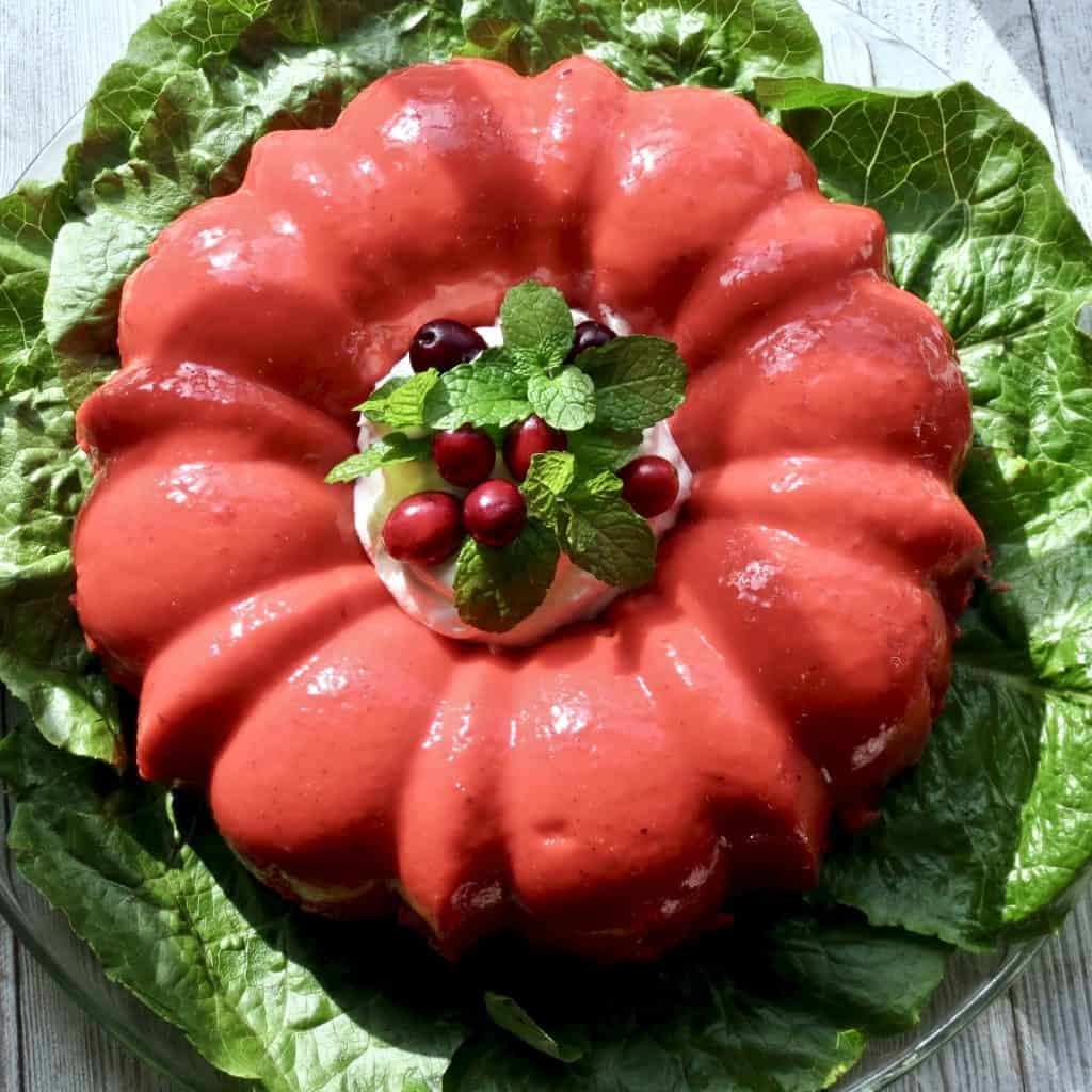 Molded Congealed Salad, Cherry Or Lime Flavored on a bed of lettuce.