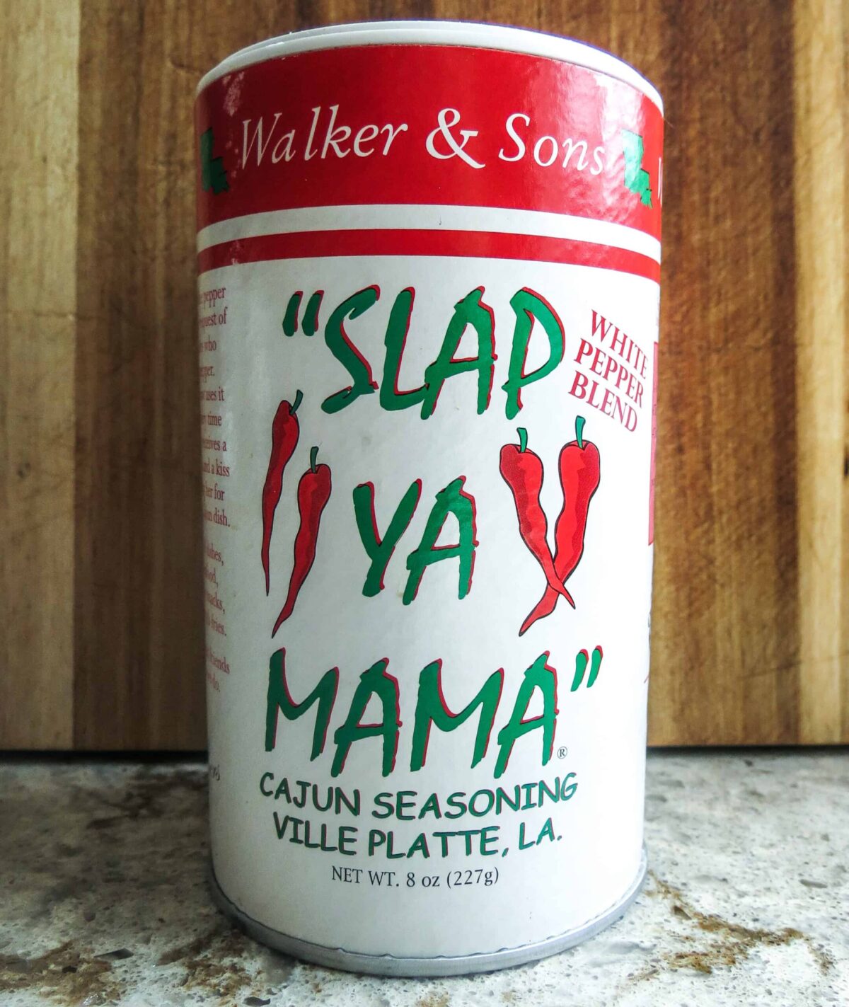 A container of Slap Ya Mama Cajun Seasoning white pepper blend for Shrimp And Corn Soup.