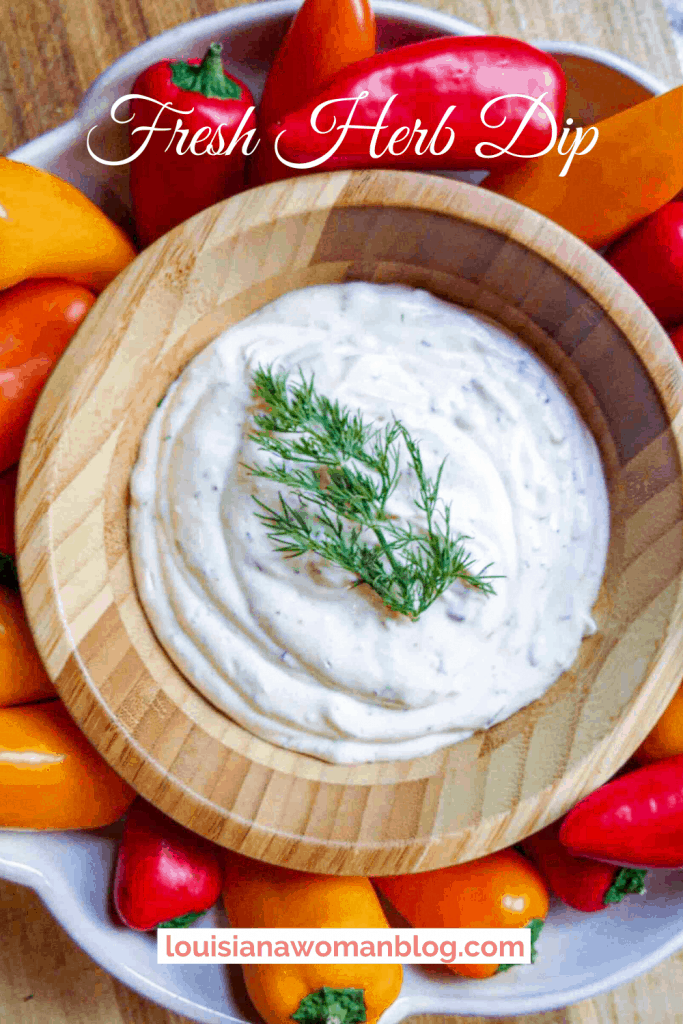 A wooden bowl of vegetable dip.