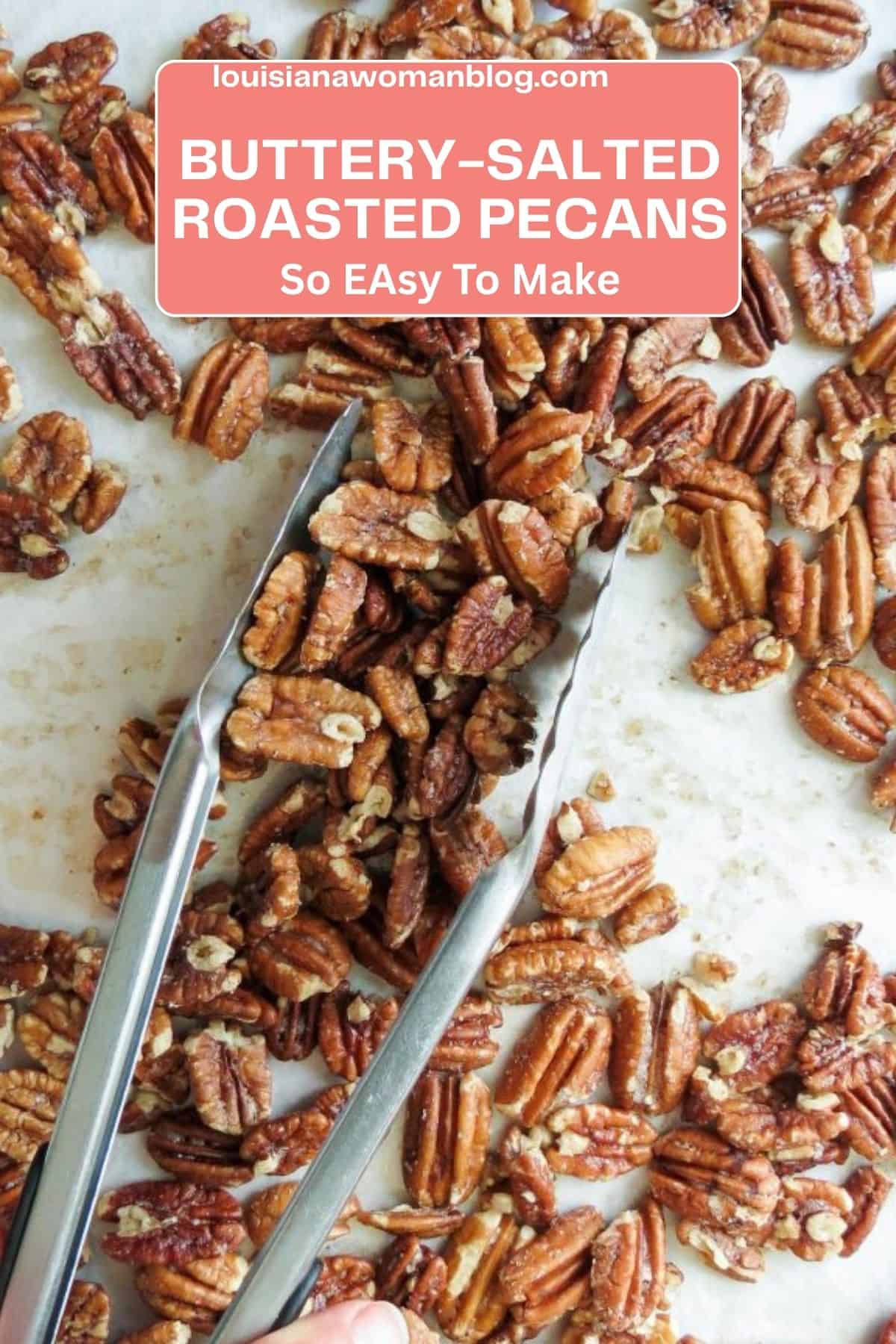 Pecan halves spread on a parchment paper lined pan with tongs grabbing pecans.