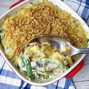 A spoonful of casserole scooped from a dish.