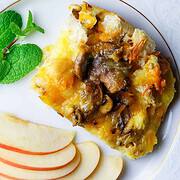 Plate of sliced apples and egg casserole with fresh mint.