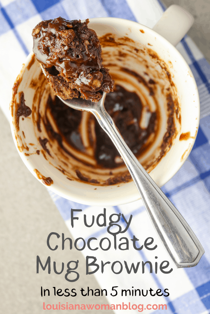 A spoonful of Fudgy Chocolate Mug Brownie over a dish.