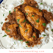 A dish of rice and fish in red gravy.