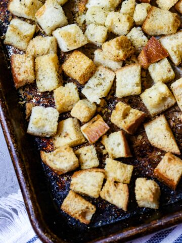 A sheet pan of baked croutons.