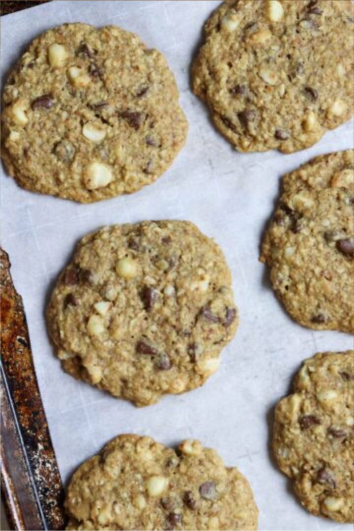 Cookies on a parchment paper lined baking sheet.