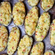 A sheet pan full of twice-baked potatoes after they are baked.