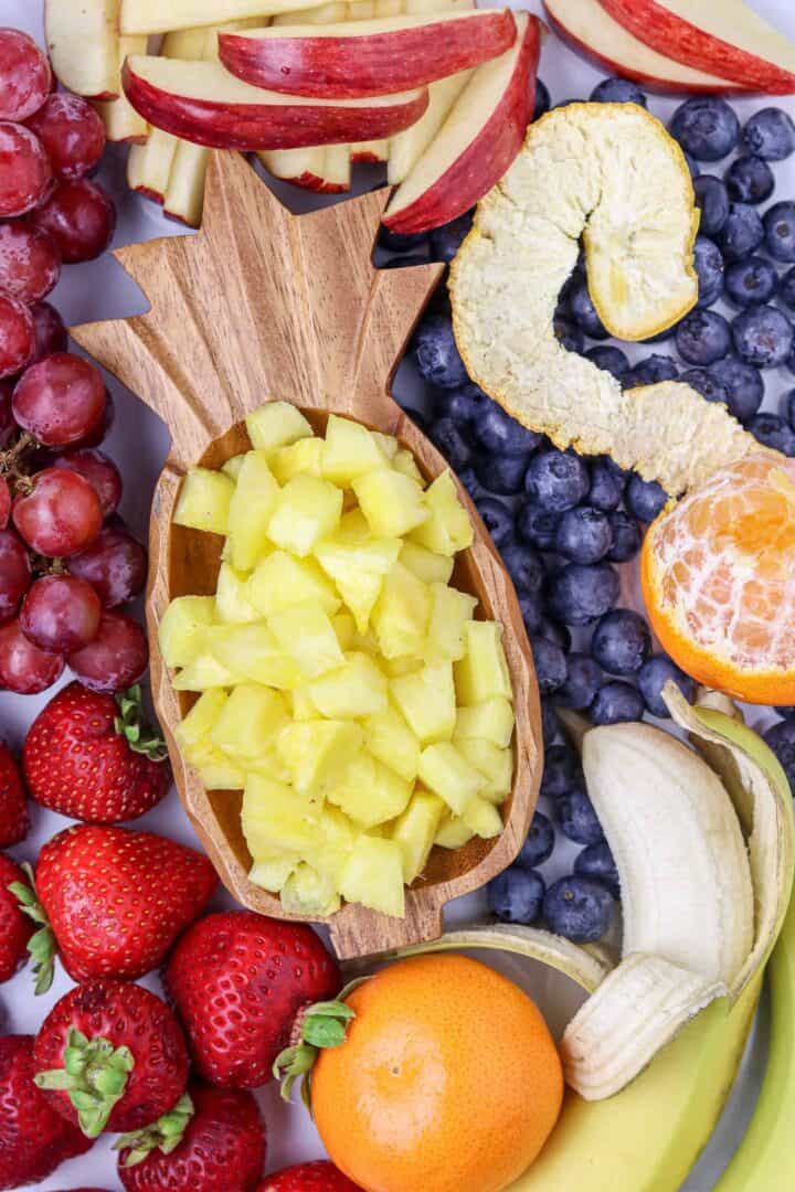 Fresh fruit scattered on a tray.