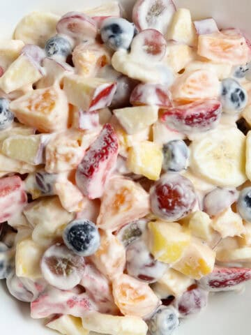 Fresh Fruit Salad in a white bowl.