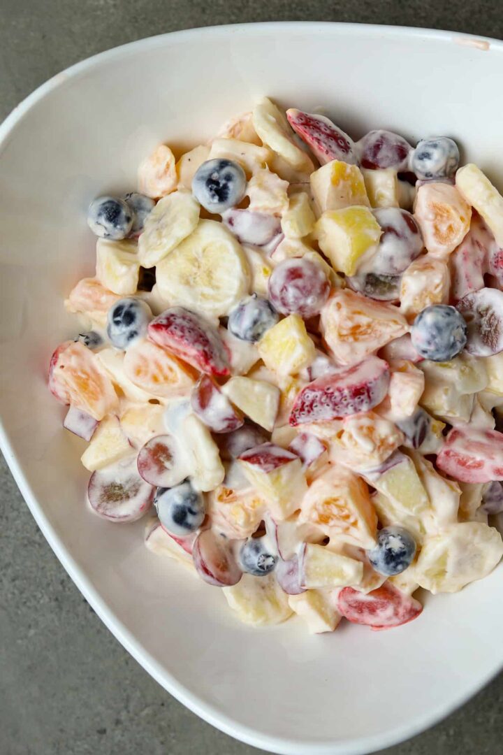 Fresh Fruit Salad in a white bowl.