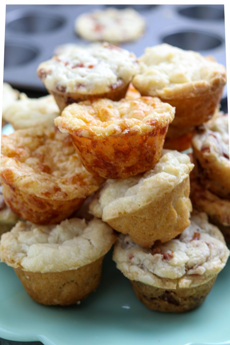 Stacked muffins on a plate.