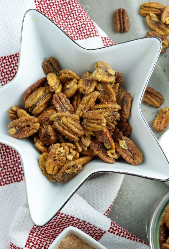Roasted pecans in a star-shaped bowl for Mardi Gras Food Recipes.