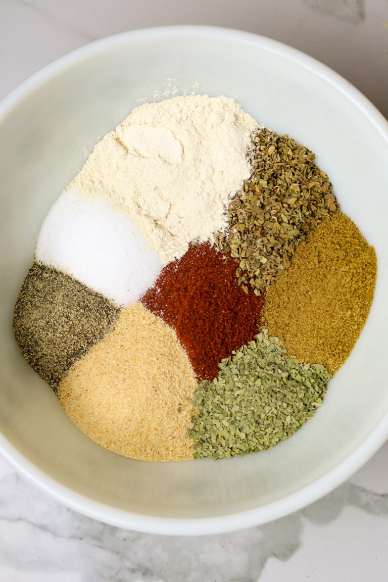 A bowl of several unmixed spices.