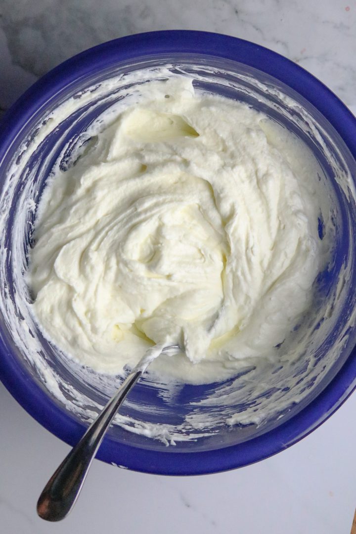 A bowl of whipped cream cheese layer.