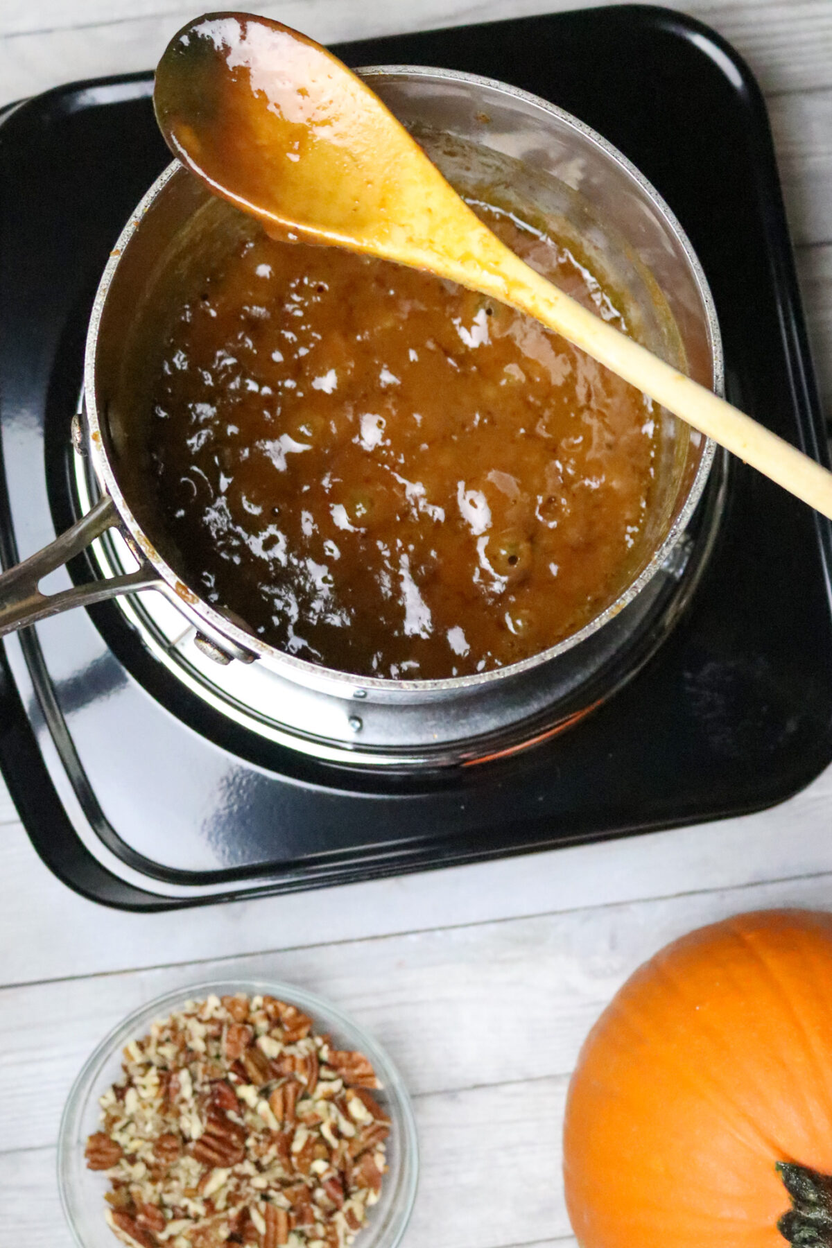 A pot of simmering brown sugar glaze.