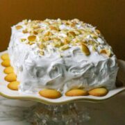 A Banana Pudding Cake-Mix Cake on a cake plate.
