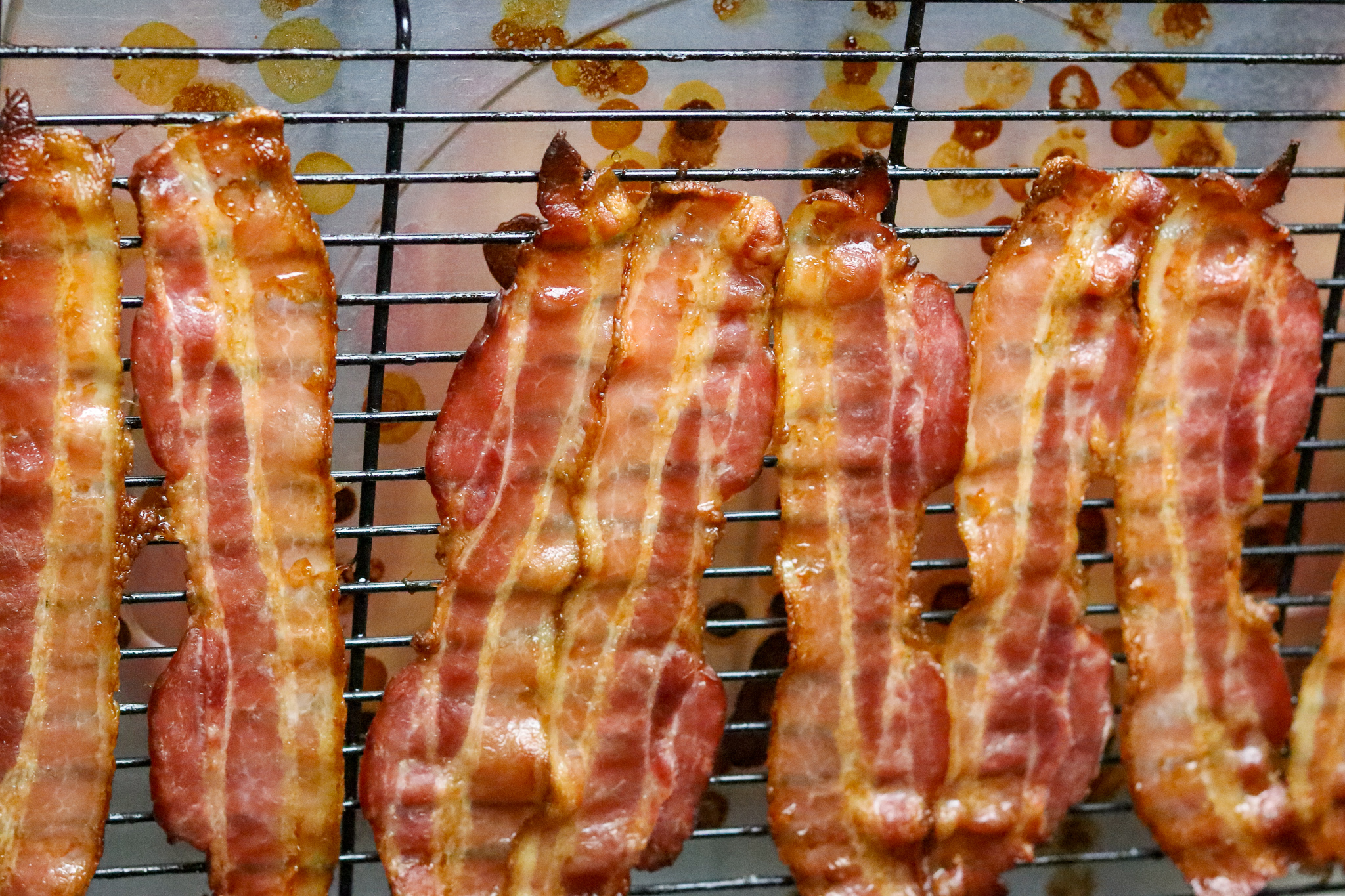 Cooked bacon on a baking rack.