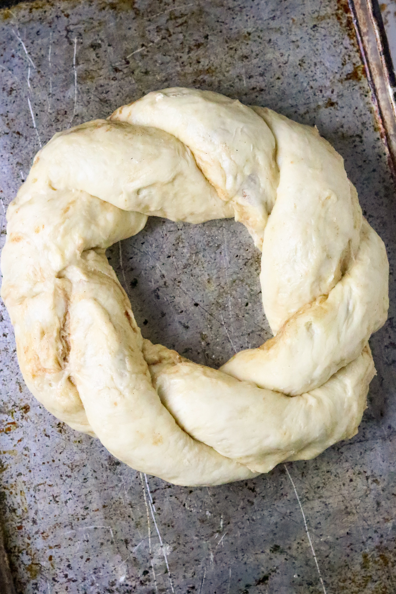 King Cake dough braided into a ring.