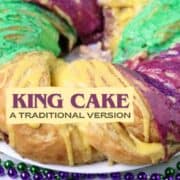 A braided King Cake baked an d iced with purple, green, and gold icing.