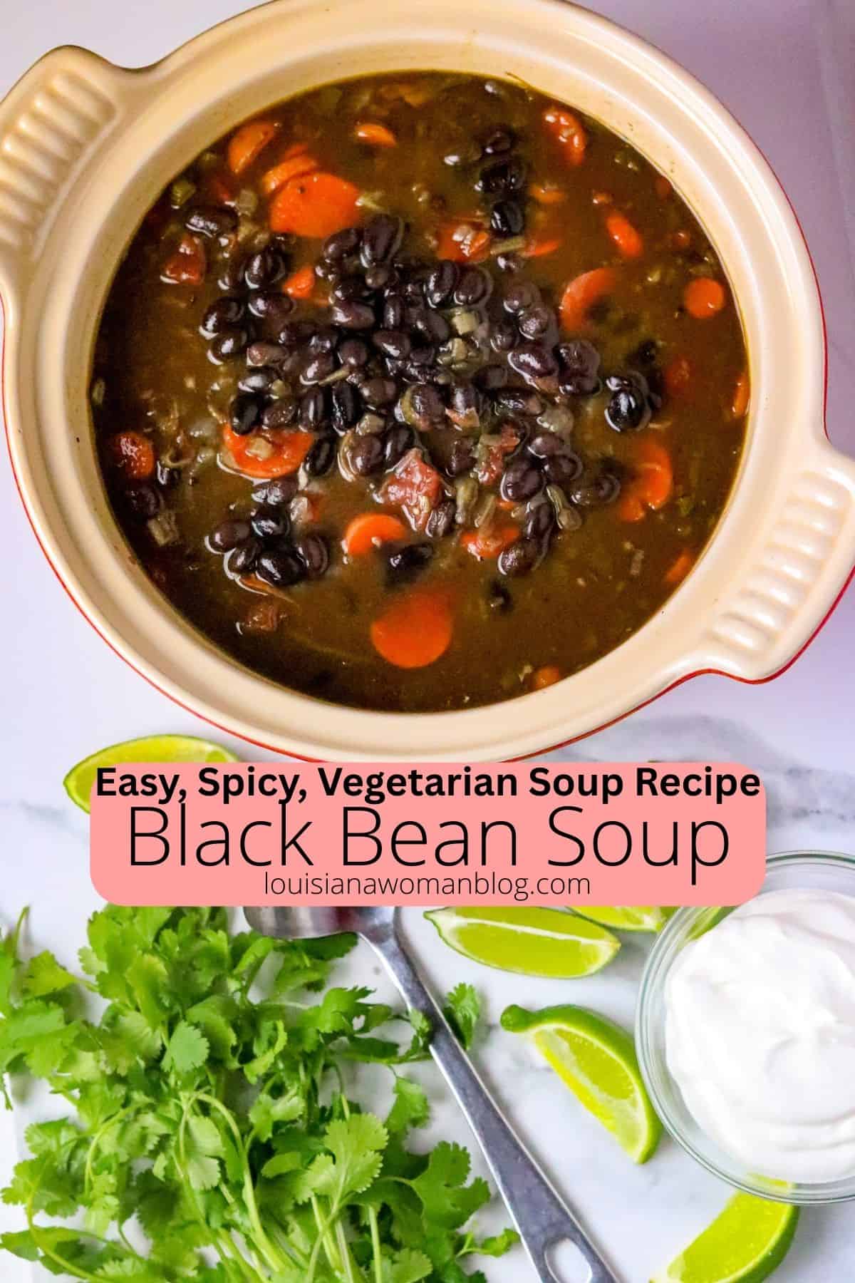 A pot of Black Bean Soup with fresh cilantro and lime slices.