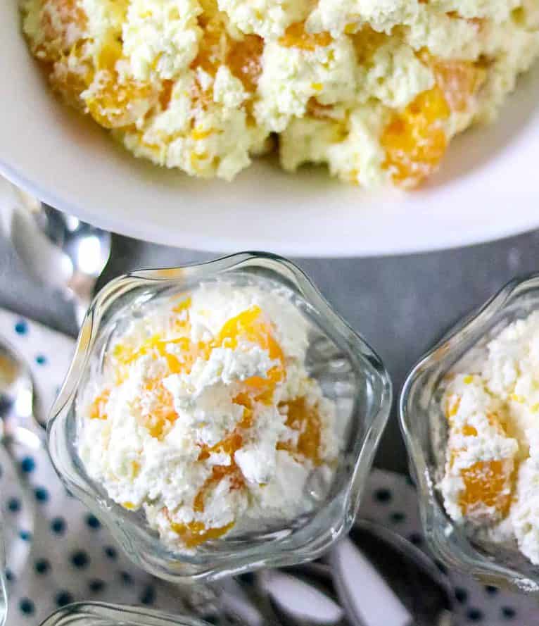 A bowl and cups ofMandarin Orange Pudding Dessert.