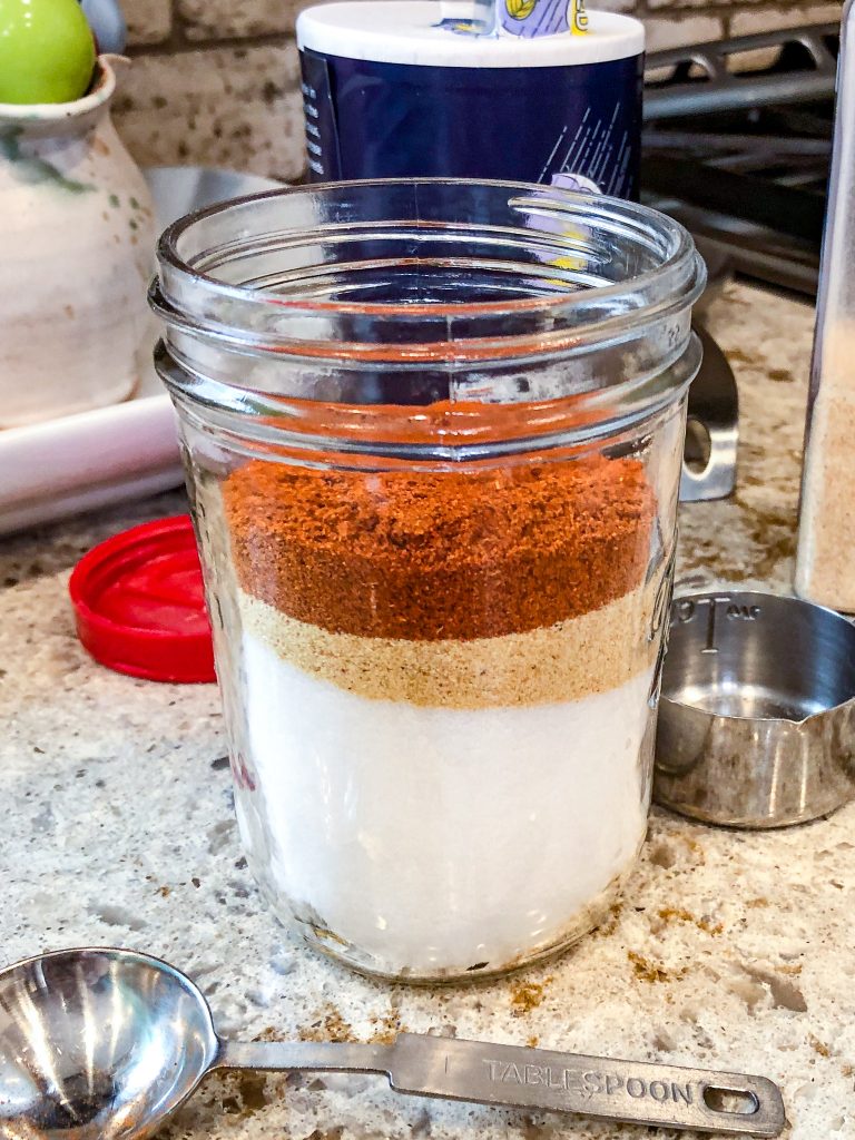 A jar with seasoning layered into the jar.