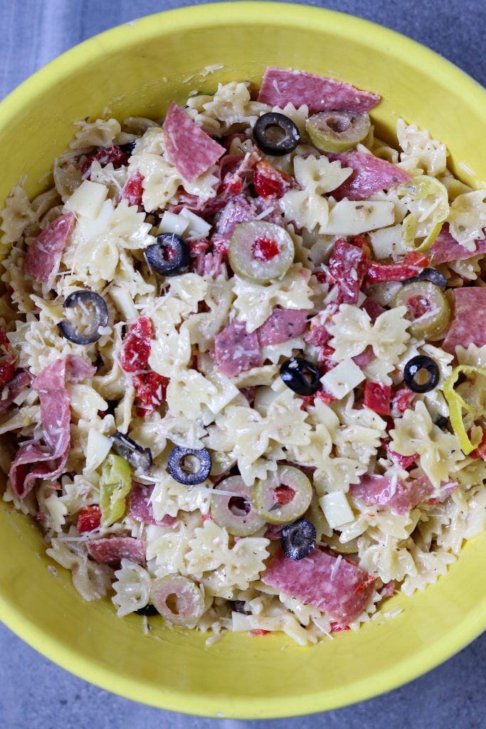 A large bowl of muffuletta pasta salad for Mardi Gras Food Recipes.