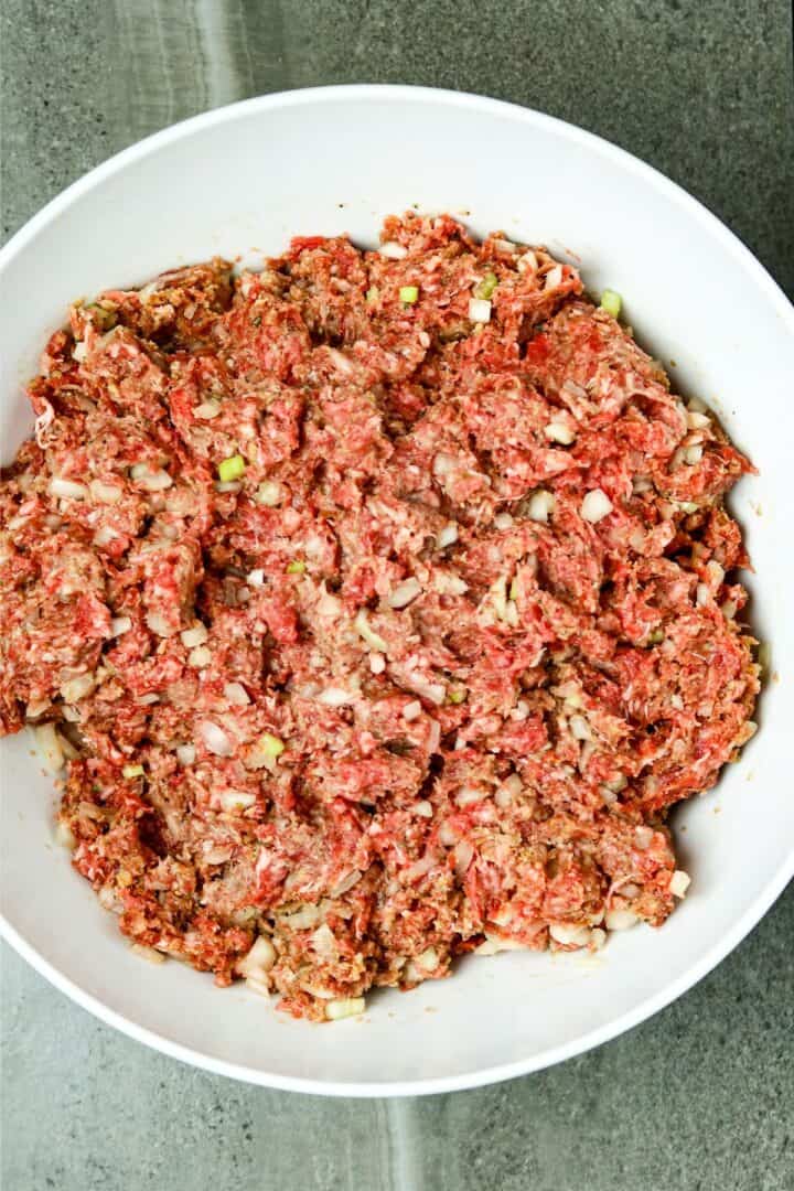 A white bowl of ground beef.