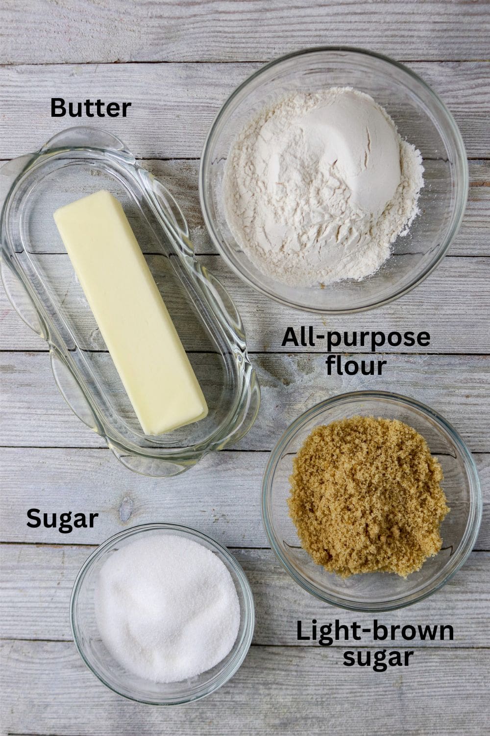 Ingredients of butter, flour, brown sugar and white sugar for a topping for apple pie.