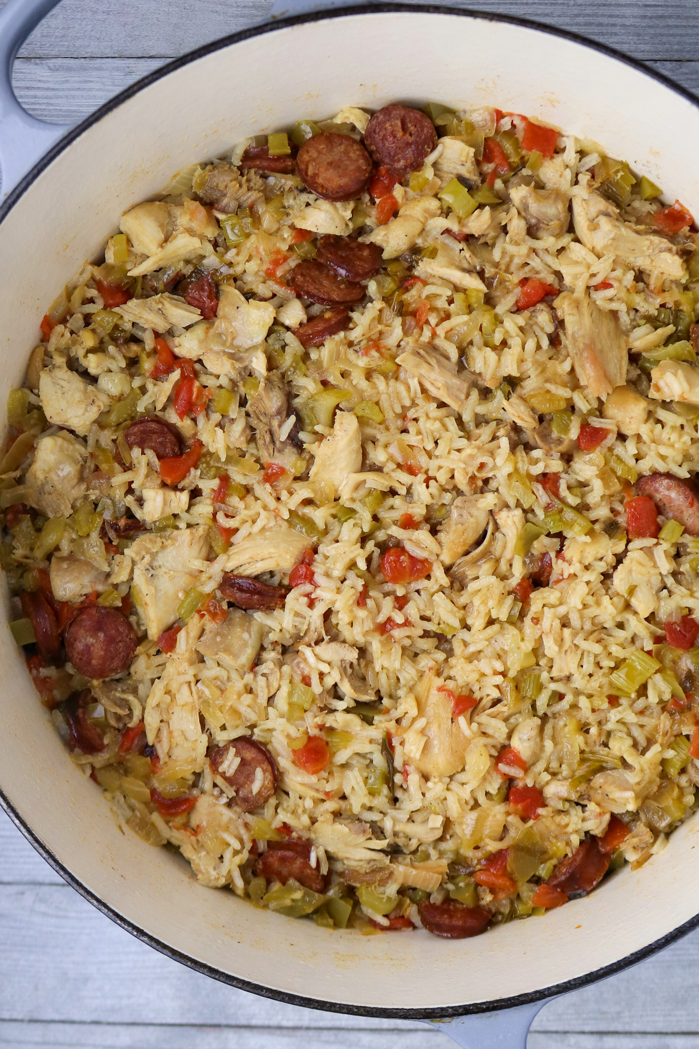 A pot of jambalaya with rice and sausage.