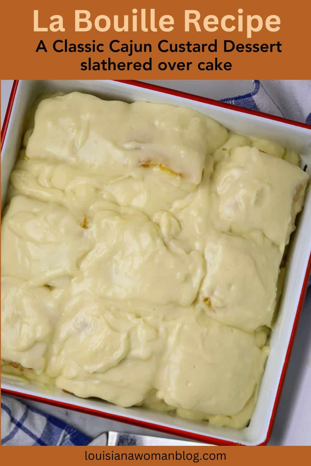 A square pan with a red trim filled with cake squared and covered with custard.