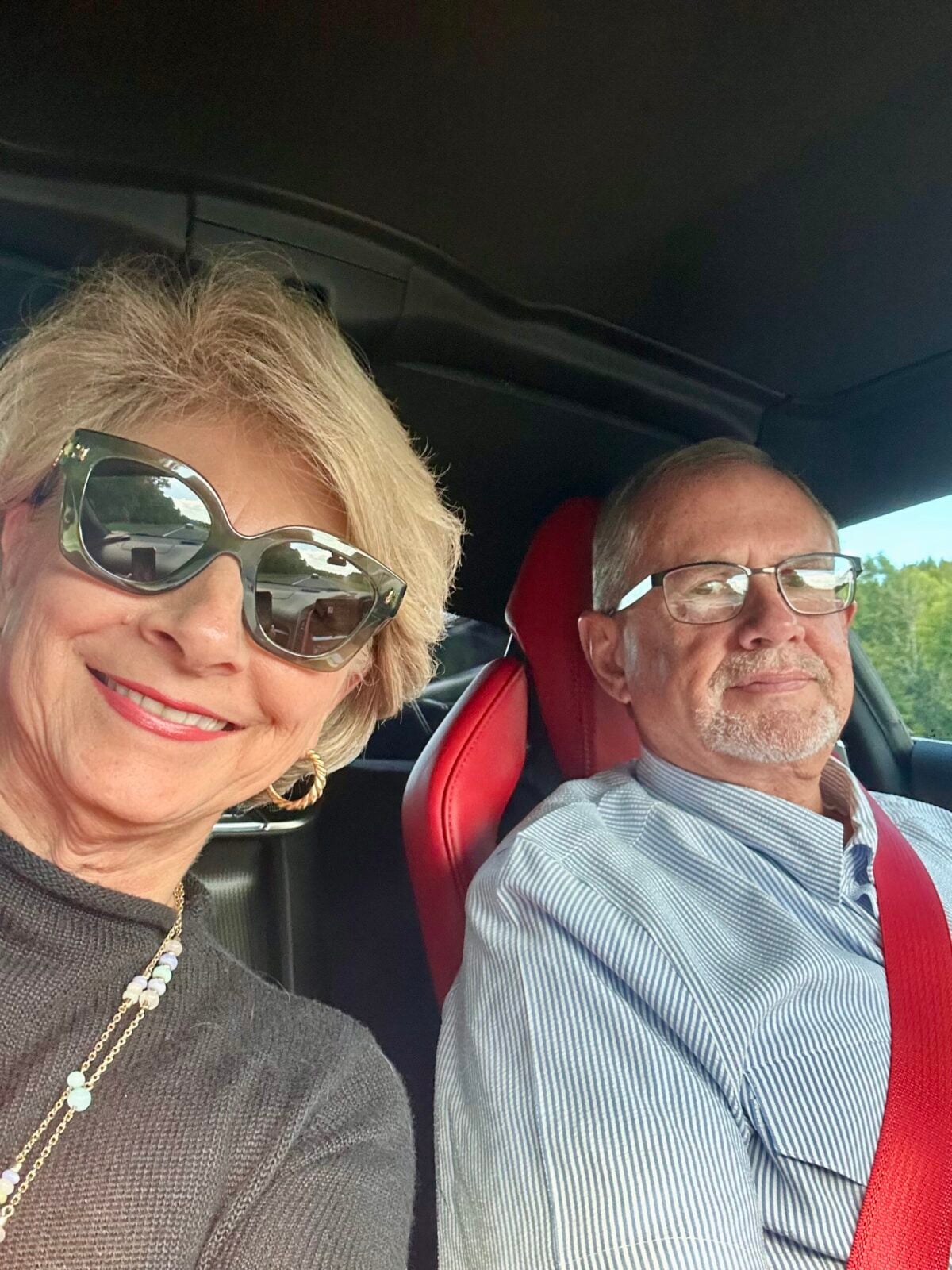 Two people sitting in a car.