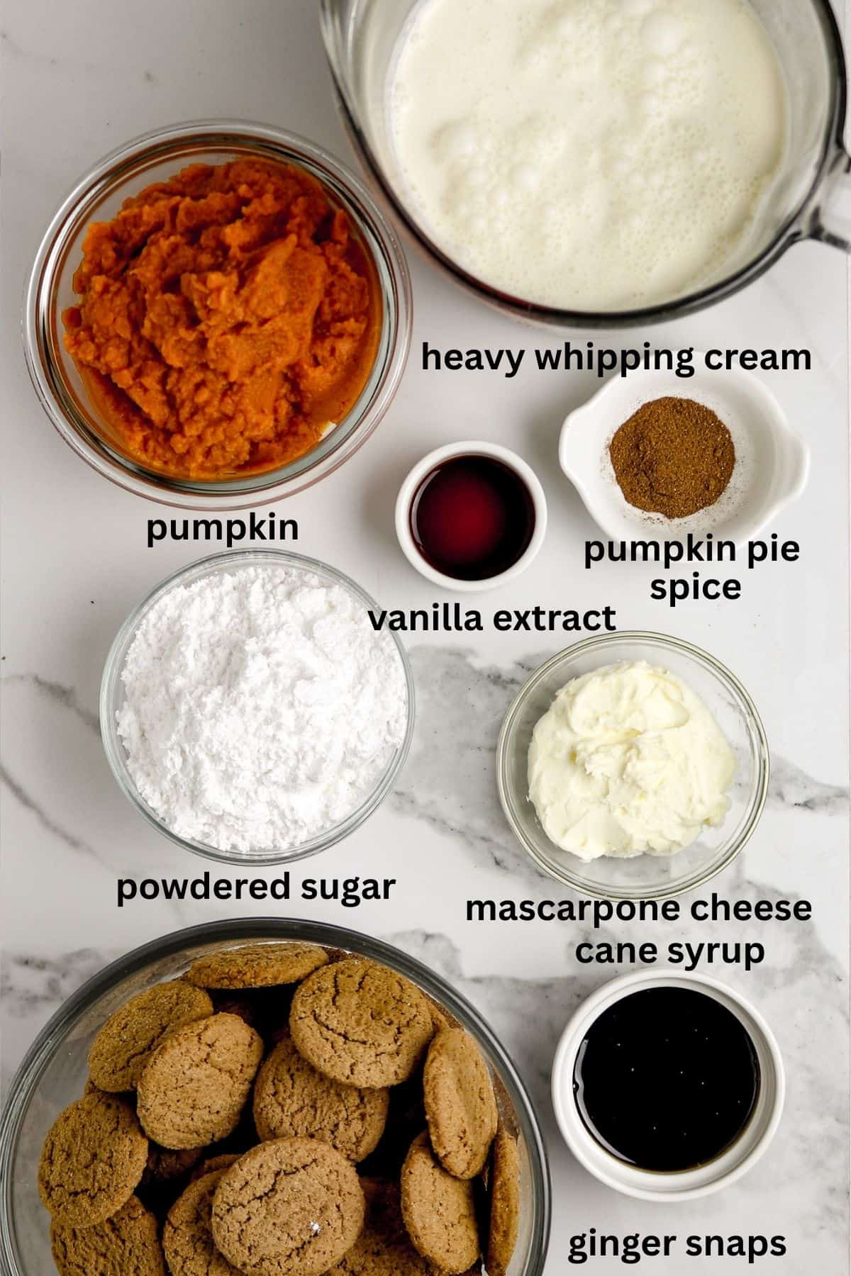 Ingredients laid out on a counter for ginger snaps pumpkin trifle.