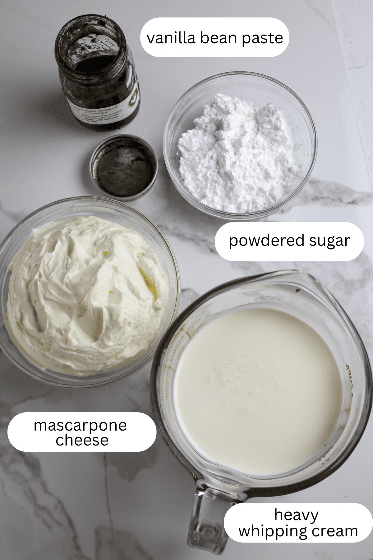Ingredients for White mascarpone cheese icing for cake.